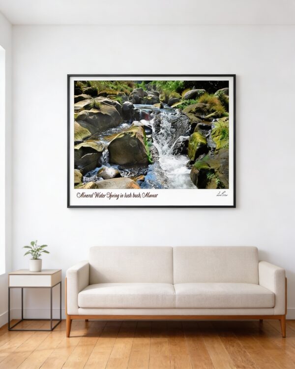 Natural rock waterfall stream framed wall art above beige sofa in modern living room with wooden floor